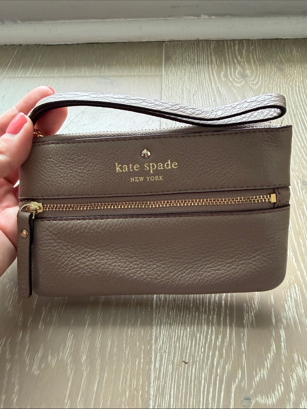 kate spade pebbled leather wristlet in taupe